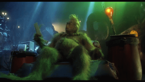 A Picture Of Grinch Reading A Book With The Words On Such Short Notice Above Him GIF