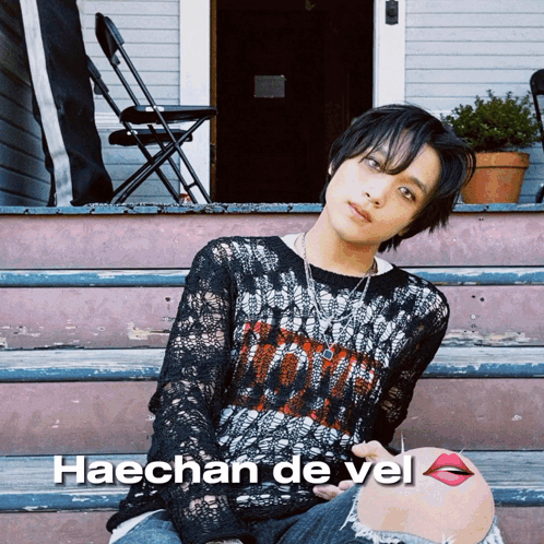 A Picture Of Haechan De Vel Sitting On The Steps GIF