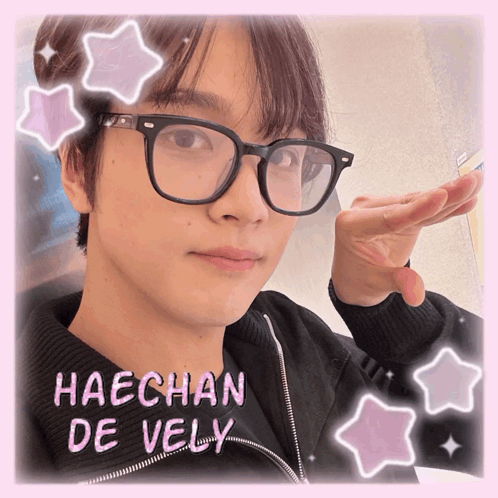 A Picture Of Haechan De Vely With Pink Stars Around His Face GIF