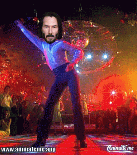 A Picture Of Keanu Reeves Dancing With A Disco Ball Behind Him GIF