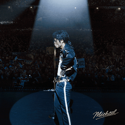 A Picture Of Michael Jackson On Stage With Smoke Behind Him GIF