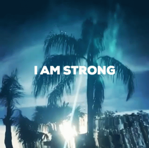 A Picture Of Palm Trees With The Words " I Am Strong " Above Them GIF