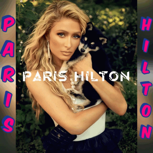 A Picture Of Paris Hilton Holding A Puppy GIF