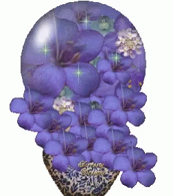 A Picture Of Purple Flowers In A Glass Sphere With A Watermark That Says Fantasy GIF
