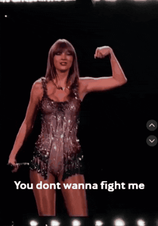 A Picture Of Taylor Swift Flexing Her Muscles With The Words You Dont Wanna Fight Me Below Her GIF