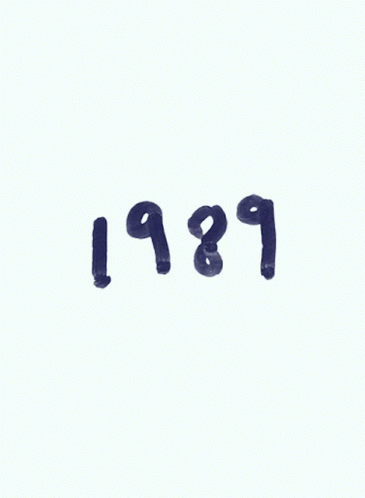 A Picture Of Taylor Swift With The Year 1989 GIF