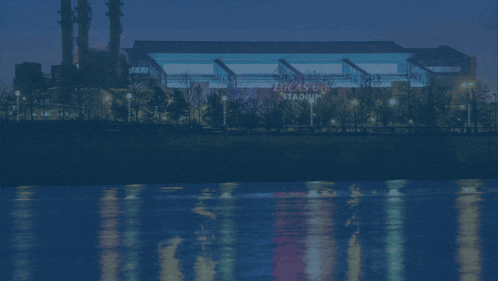 a picture of the indianapolis colts stadium with a river in the background