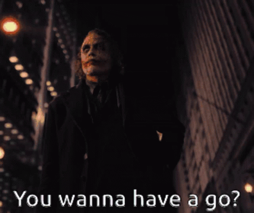 A Picture Of The Joker With The Words " You Wanna Have A Go " Below Him GIF