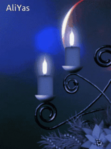 A Picture Of Two Lit Candles With The Name Aliyas On The Bottom Right GIF