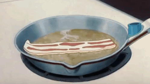 A Piece Of Bacon Is Being Cooked In A Pan GIF