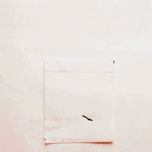 A Piece Of Paper With The Letter M Written In Black Marker GIF