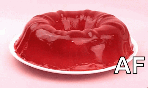 A Piece Of Red Jelly On A White Plate With The Letters Af Below It GIF
