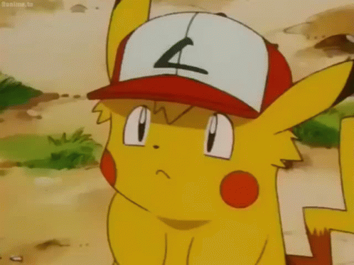 A Pikachu Is Looking At Himself In A Mirror While Wearing A Hat With The Letter A On It . GIF