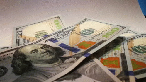 A Pile Of 100 Dollar Bills With A Picture Of Benjamin Franklin GIF