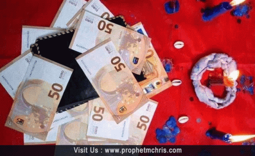 A Pile Of 50 Euro Bills Laying On A Red Cloth GIF