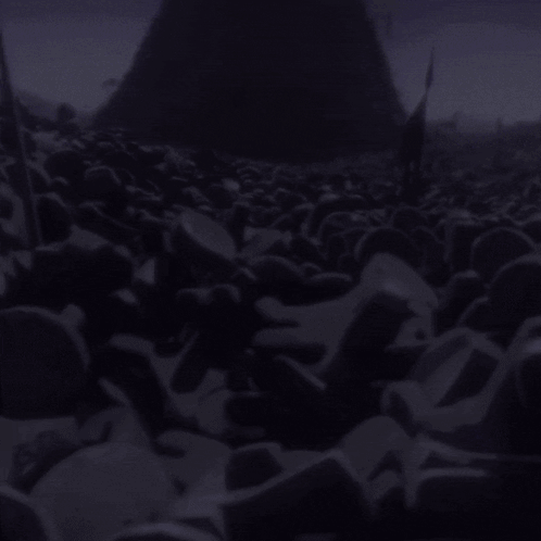 a pile of purple rocks in front of a purple pyramid