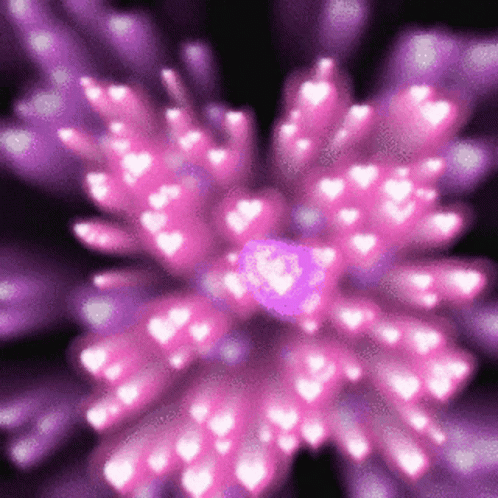 A Pink And Purple Flower With Hearts Coming Out Of It GIF