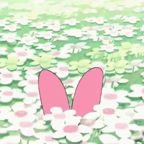 A Pink And White Bunny With A Flower On Its Head Is Jumping In The Air In A Field Of Flowers . GIF