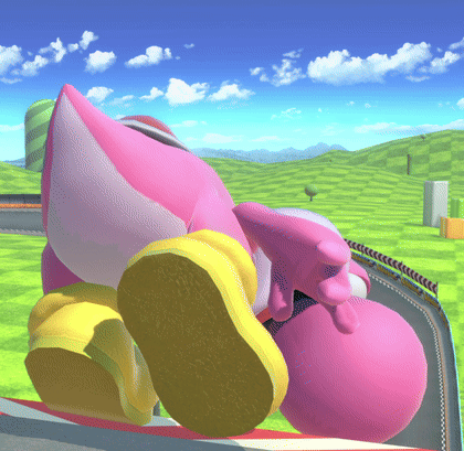 A Pink And White Cartoon Character Is Laying On The Ground GIF