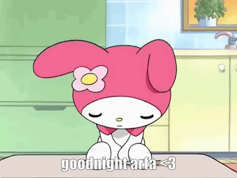 a pink and white cartoon character with a flower on her head is sitting on a table and says goodnight aria < 3 .