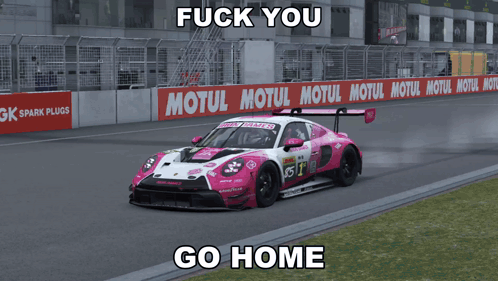 A Pink And White Race Car On A Track With A Motul Sign In The Background GIF