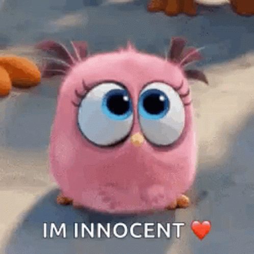 A Pink Angry Bird From The Angry Birds Movie Is Sitting On The Ground With A Heart . GIF