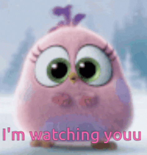 a pink angry bird is standing in the snow and says `` i 'm watching youu ''