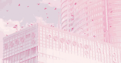 A Pink Building With Birds Flying Around It GIF
