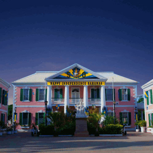 A Pink Building With The Words Happy Independence Bahamas On The Top GIF