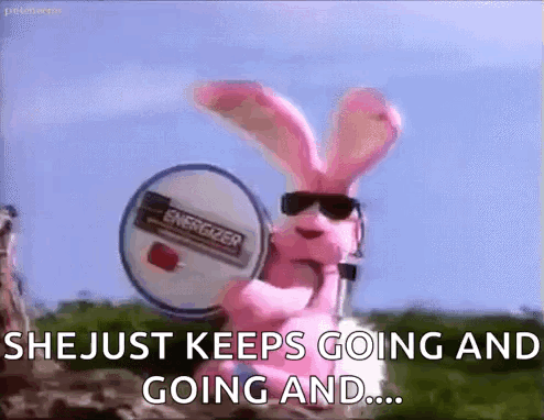 A Pink Bunny Rabbit Wearing Sunglasses Is Holding A Drum . GIF