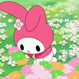 A Pink Bunny With A Flower On Its Head Is Standing In A Field Of Flowers GIF