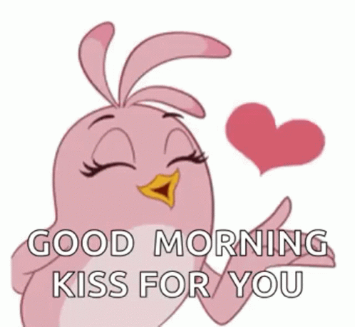 A Pink Cartoon Bird Is Blowing A Kiss With A Heart In Its Beak . GIF