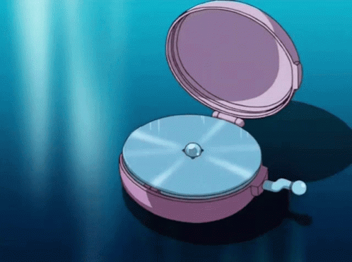 A Pink Clock With A Blue Disc Inside Of It GIF