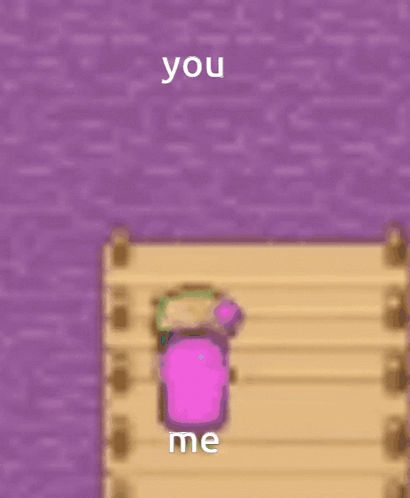 A Pink Cube Is Sitting On A Wooden Dock Next To A Purple Wall And Says You Me GIF