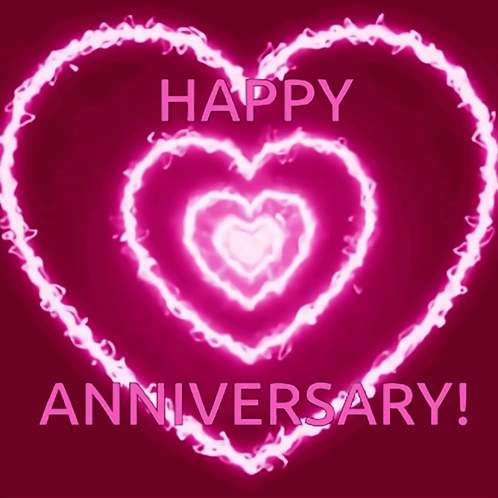 A Pink Glowing Heart With The Words Happy Anniversary Written Below It GIF