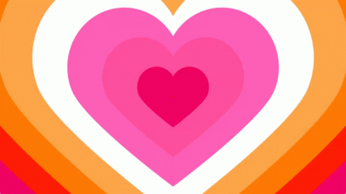 A Pink Heart Is In The Middle Of A Rainbow Of Hearts GIF