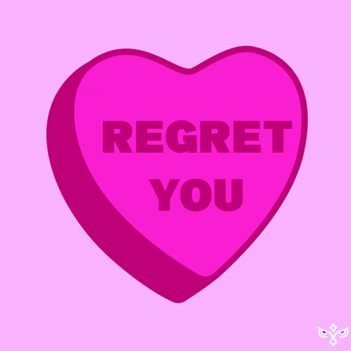 A Pink Heart Shaped Candy That Says Regret You GIF