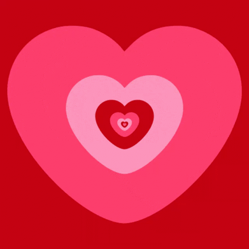A Pink Heart With A Smaller Heart In The Middle GIF
