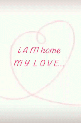 A Pink Heart With The Words I Am Home My Love Written Inside Of It GIF