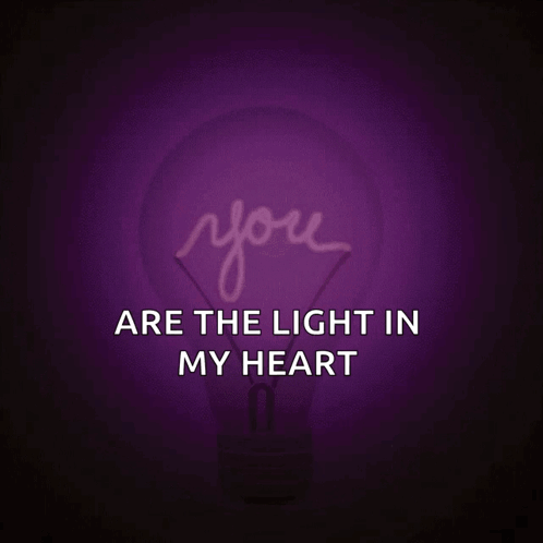 A Pink Light Bulb With The Words You Are The Light In My Heart GIF