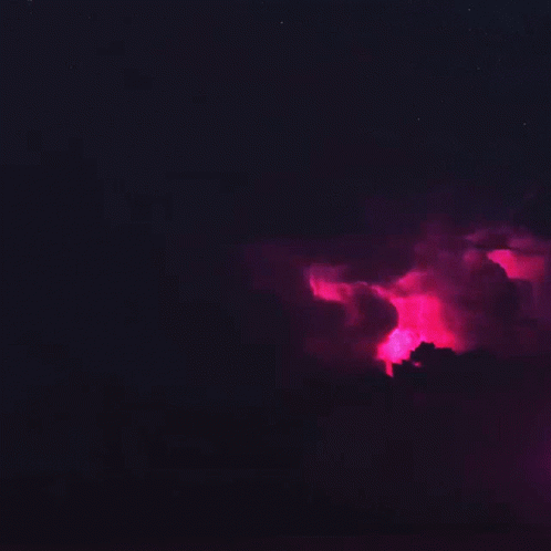 A Pink Lightning Bolt Is Coming Out Of A Cloud GIF