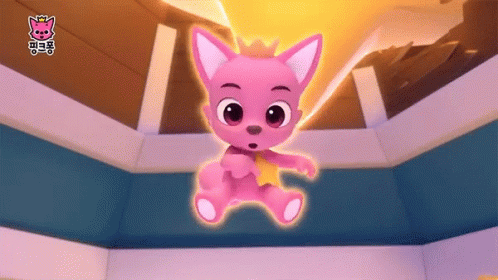 A Pink Stuffed Animal With A Crown On Its Head Is In A Room GIF
