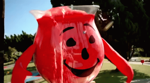 A Pitcher Of Kool Aid With A Smiling Face GIF