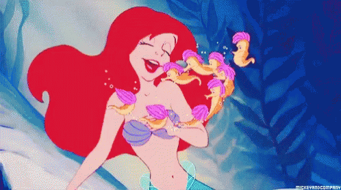 A Pixel Art Of Ariel From The Little Mermaid Surrounded By Seashells GIF