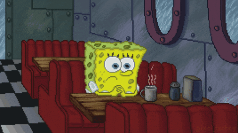 A Pixel Art Of Spongebob Squarepants Sitting At A Table With A Cup Of Coffee GIF
