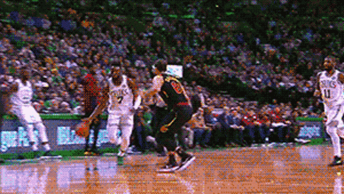 A Pixelated Image Of A Basketball Game With A Player Wearing A Number 20 Jersey GIF
