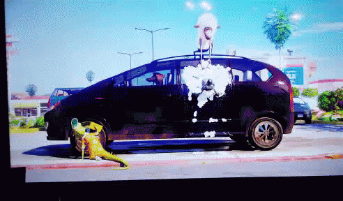 A Pixelated Image Of A Car With A Cartoon Character On The Back GIF