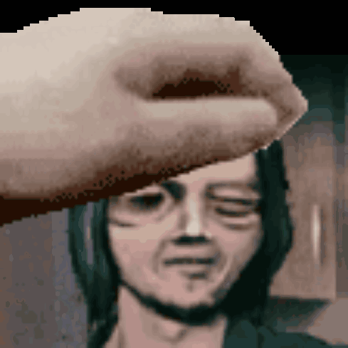 A Pixelated Image Of A Hand Touching A Man 'S Forehead With His Eyes Closed GIF