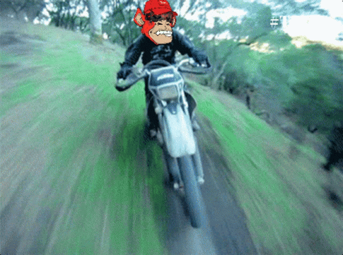 A Pixelated Image Of A Man Riding A Motorcycle On A Grassy Hill GIF