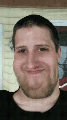 A Pixelated Image Of A Man With A Beard GIF